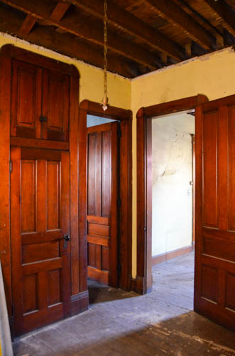 The closet door and upper cabinet that we are using as the doorway for the basement stairs