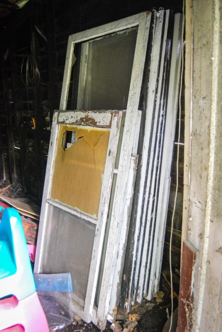 Storm windows just waiting for us in the shed