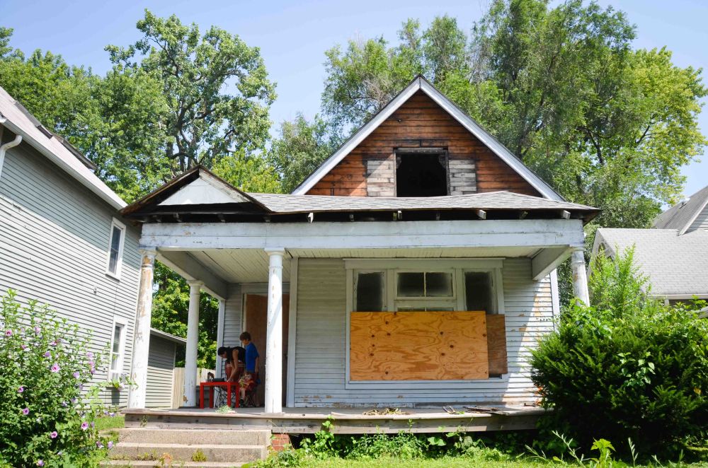 Asbestos siding gone, a hole from the vent
