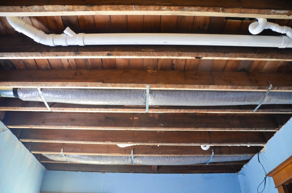 duct work and plumbing in the floor joists