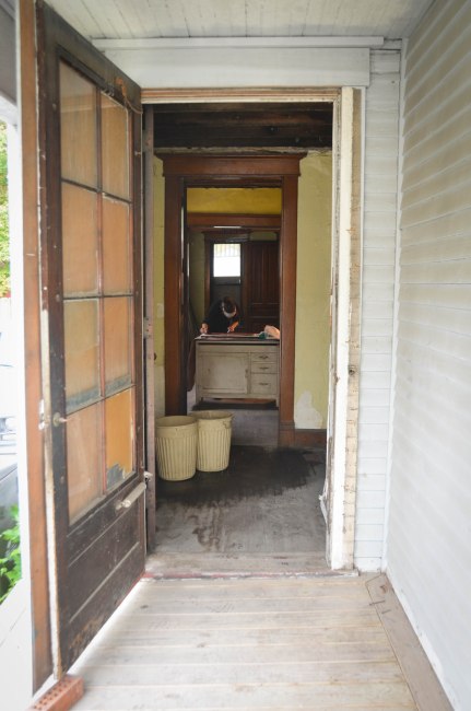 Taking in some water in the vestibule. Enjoying natural light and fresh air through the open front door.