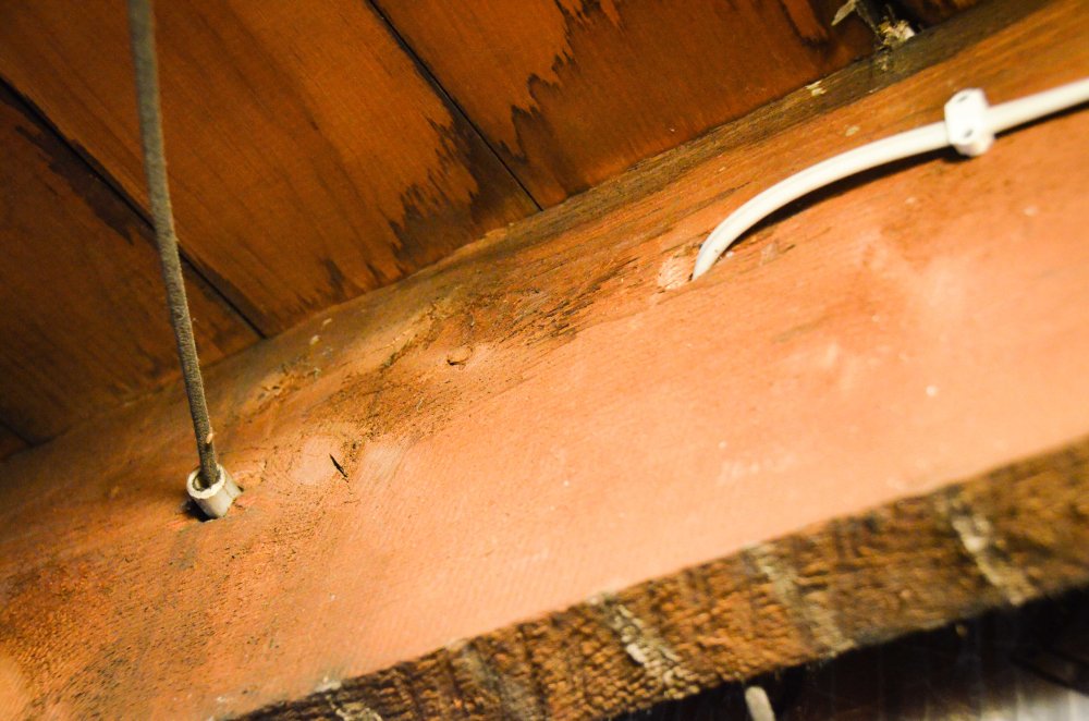 Old knob and tube wiring and new cable run side by side