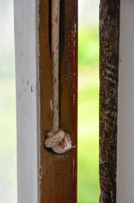 The knot is tucked into the side of the sash