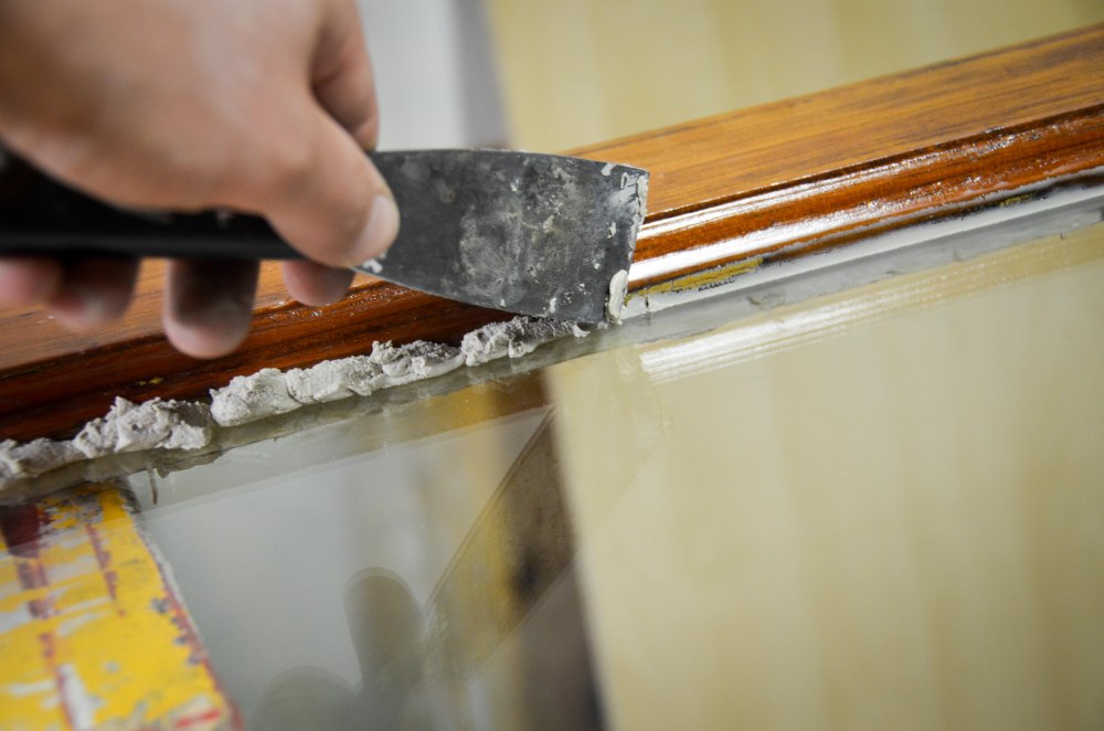 Removing excess putty from interior side