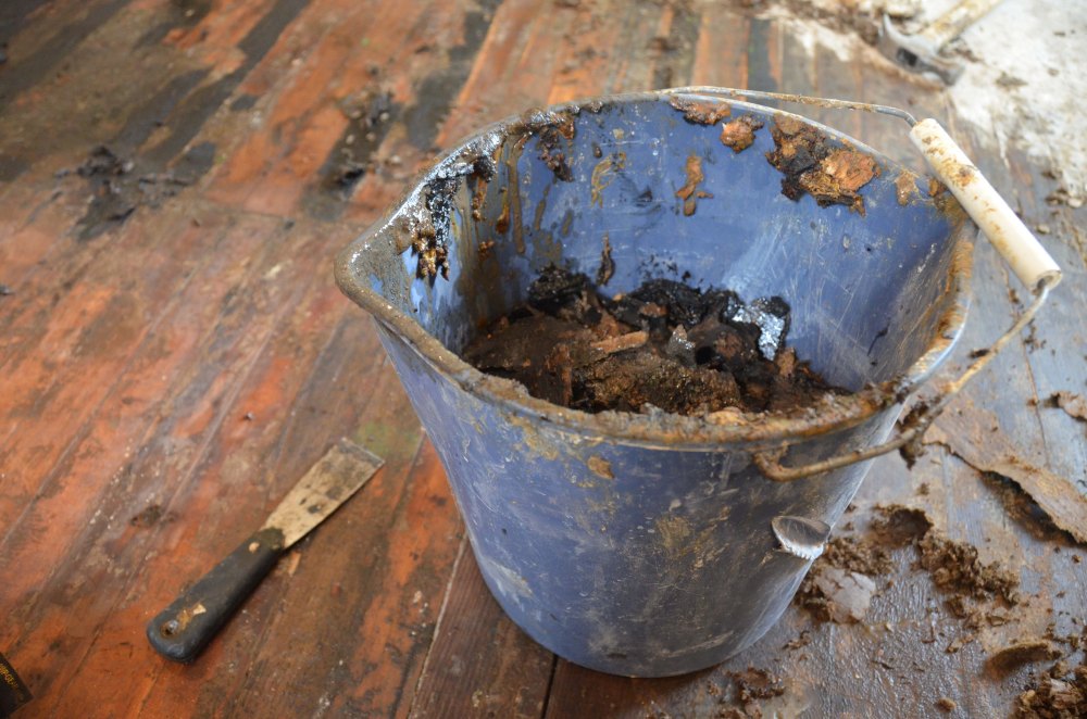 Bucket of mastic tar