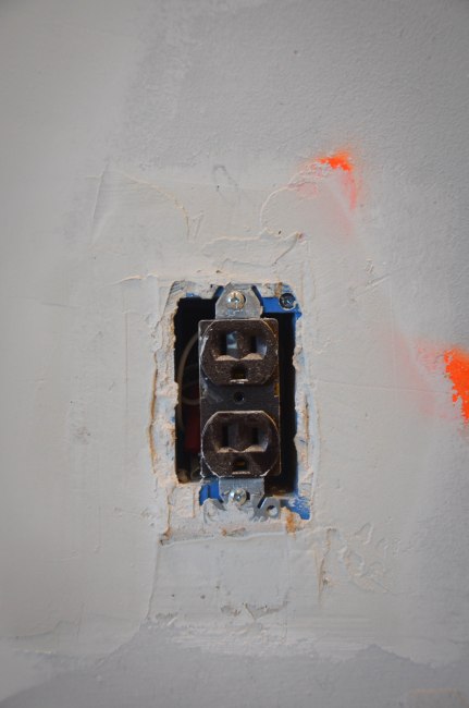 Using new plaster to snug in any loose outlets