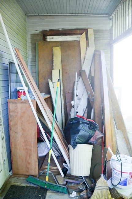 The back porch remains a lumber/scrap area